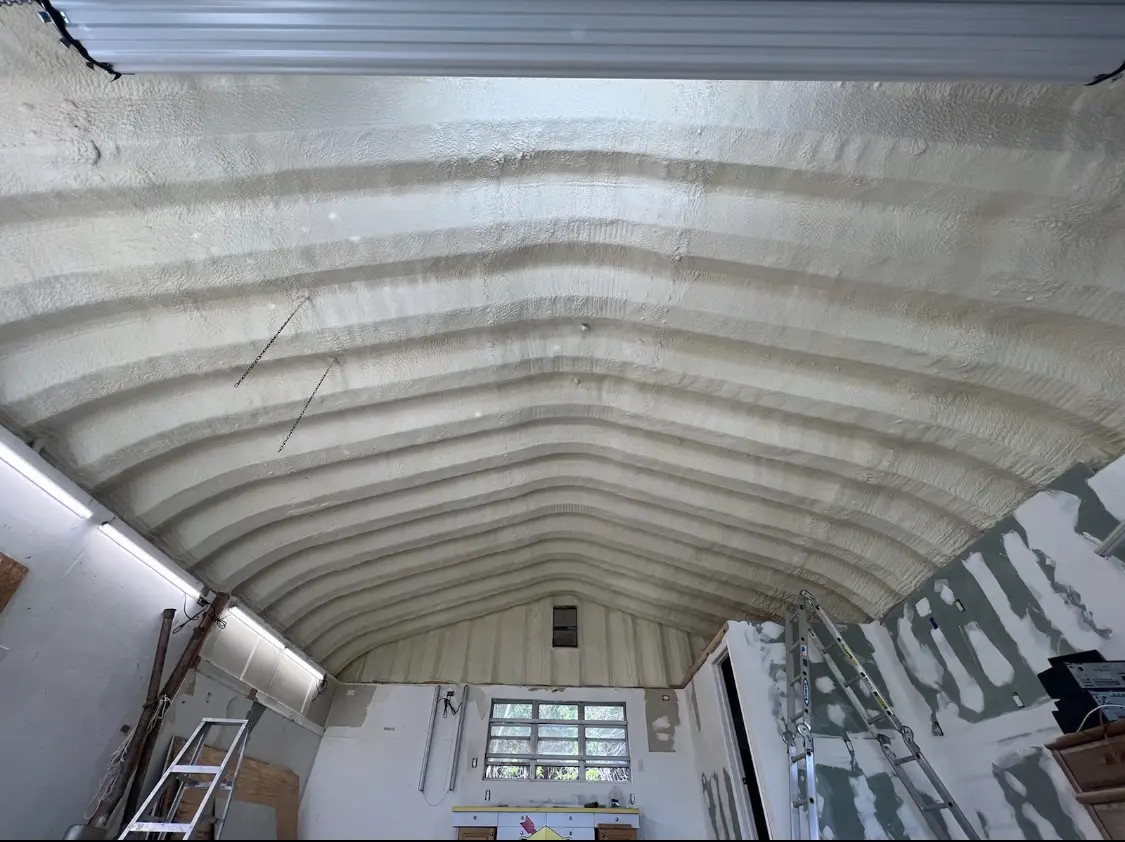 Spray polyurethane foam applied to the underside of a metal roof deck in Skaneateles